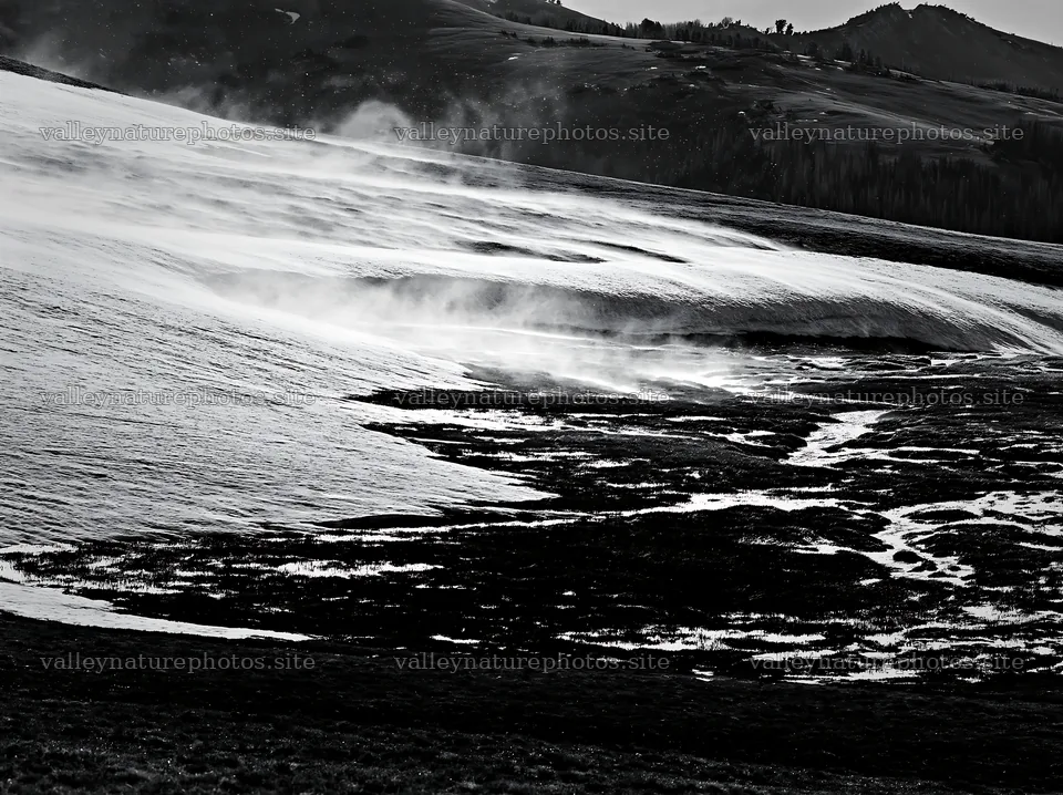Black and white landscape of meadow with snow and water flow – nature photography 9174x6866