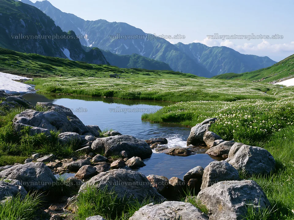 Toyama alpine meadow with snowmelt and rocks in foreground – nature photography 9174x6866
