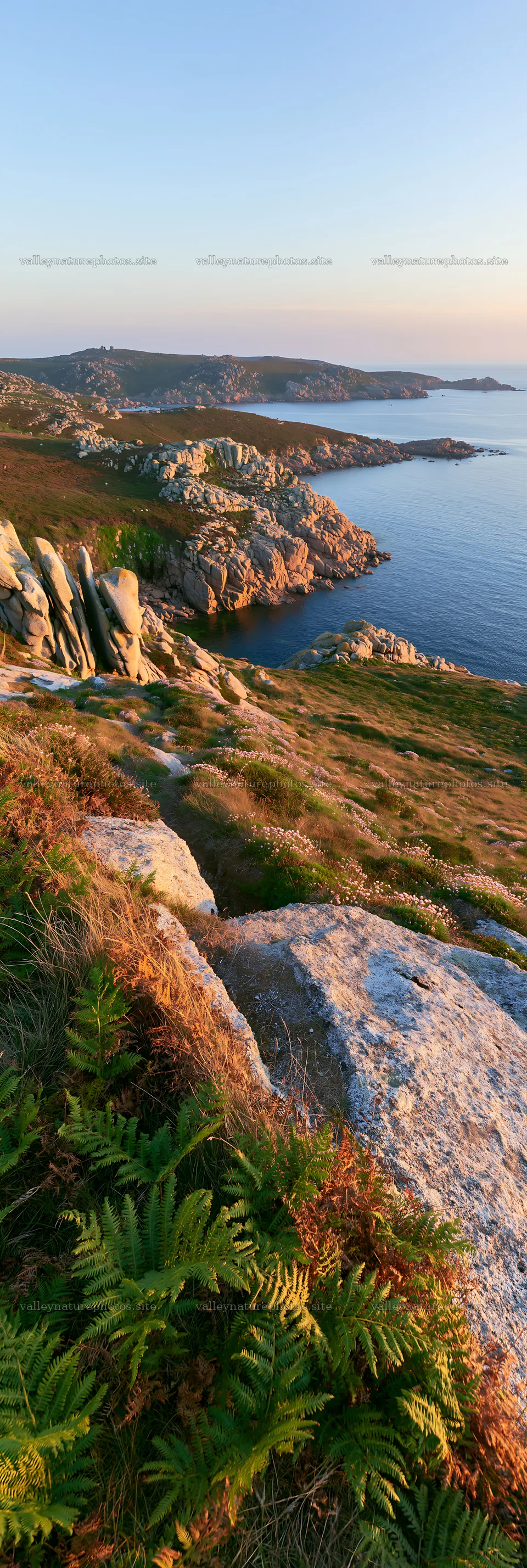 Clifftop meadow with rocky terrain overlooking the ocean – nature photography 4602x13690
