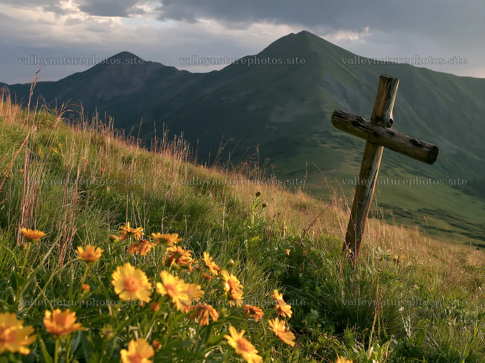 Wooden cross in mountain meadow with flowers and hills – nature photography 9174x6866